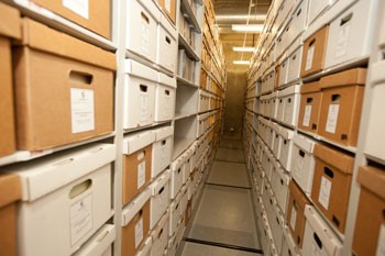 Records shelved in the archives storage facility in Aquinas Hall