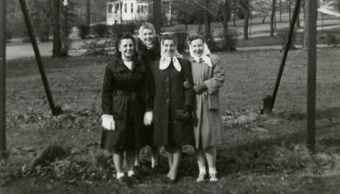Historical photo of four women on the Catholic University campus