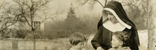 Nun with three small children during World War One