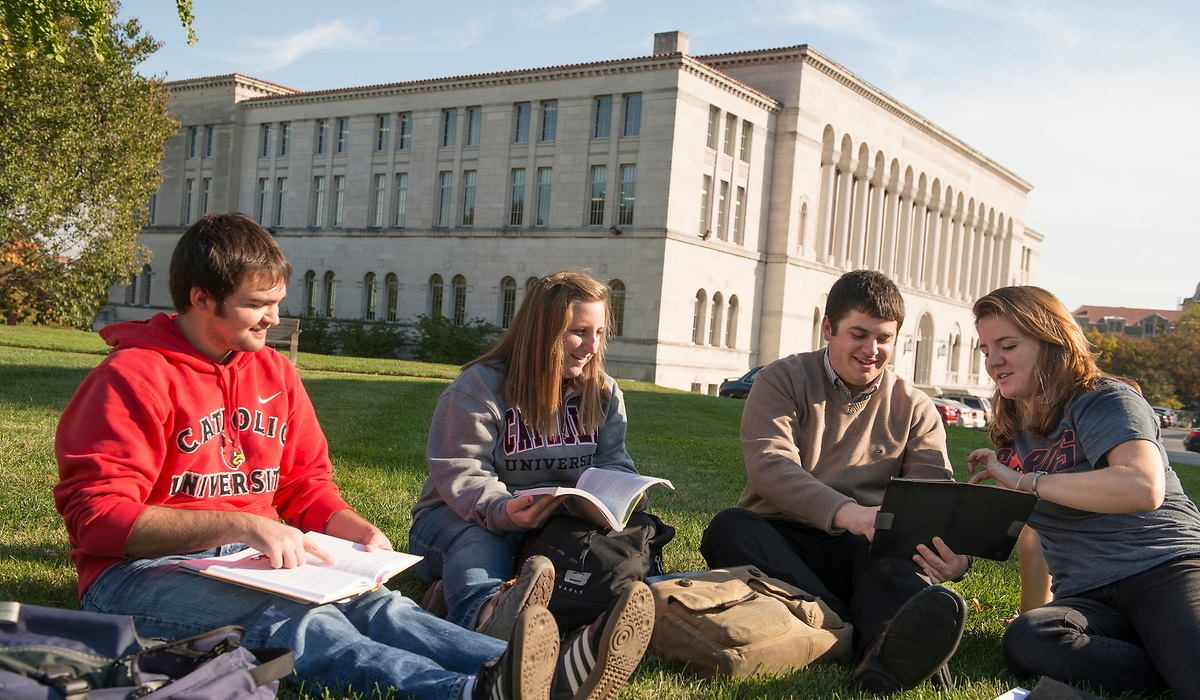 Students studying outside Mullen Library